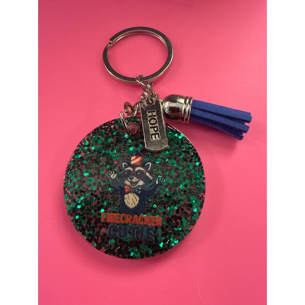 Firecracker Cutie Raccoon Keychain Green Glitter Resin Hope Charm Blue Tassel